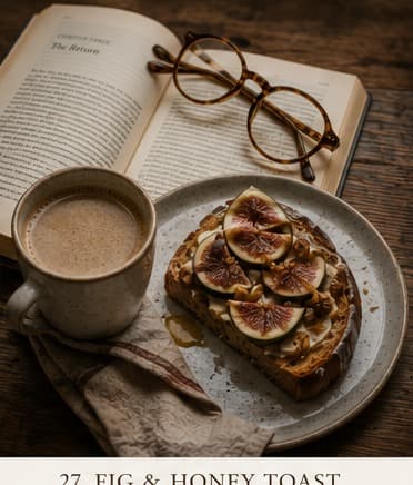 A slice of sourdough toast topped with creamy ricotta and honeyed fig slices, served with a cup of coffee and fresh figs alongside.